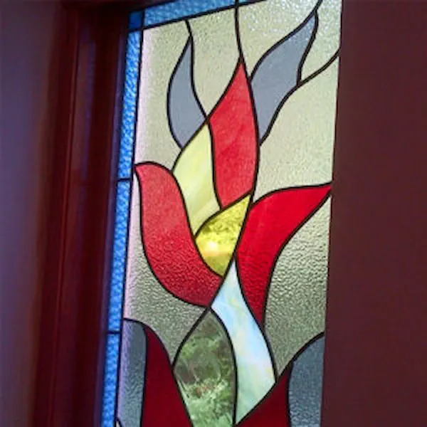 Stained glass window with red and yellow flame design